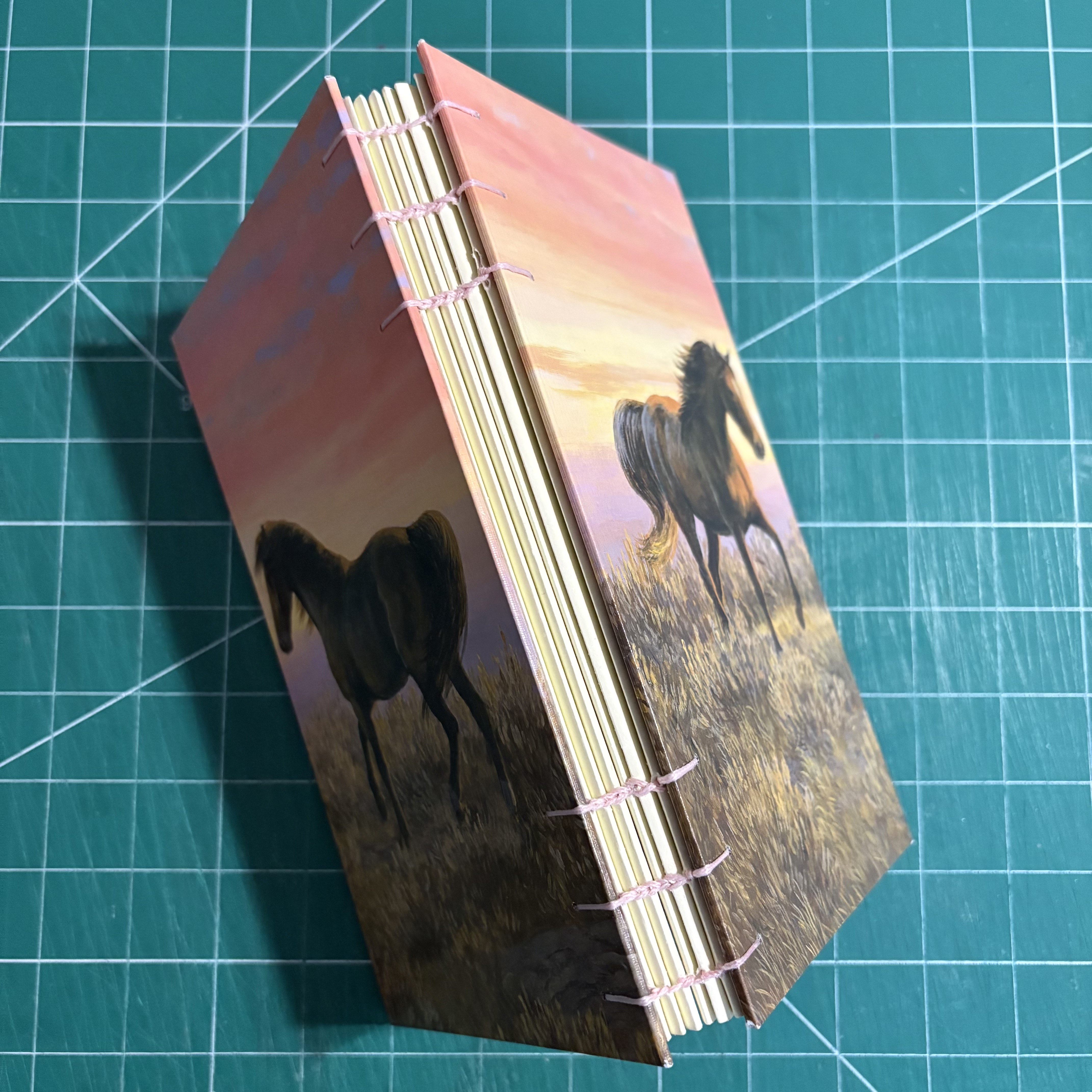 Coptic Horse Sunset Dotted Notebook - spine